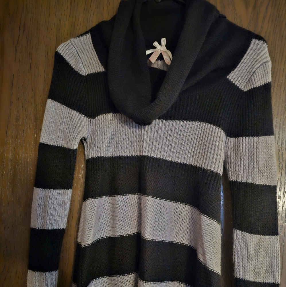 Women's striped sweater shirt with cowl neck long sleeves.